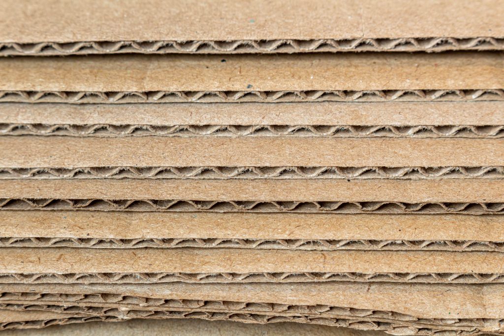 cardboard-carton-layers-side-view-edges-texture-background-close-up-min (1)