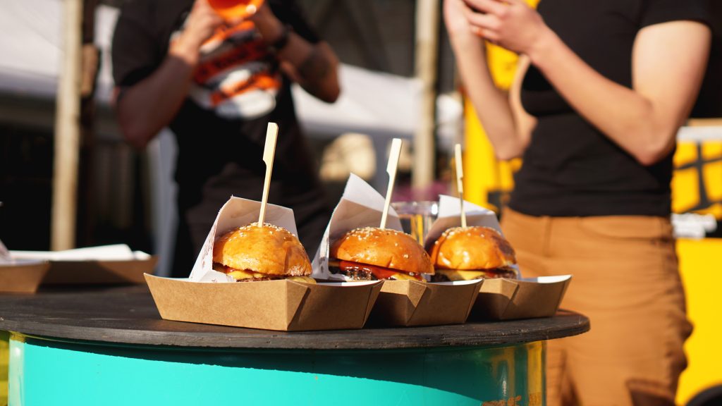 Beef burgers being served on food stall on open kitchen