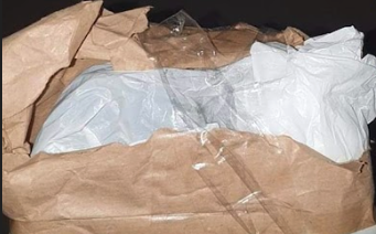 Image of torn paper packaging